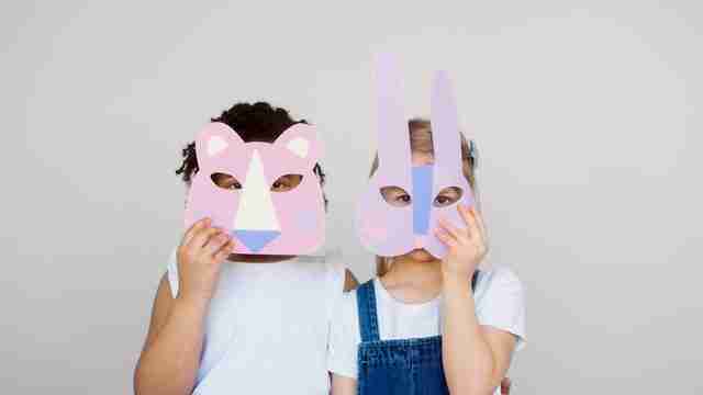 childhood friends wearing paper masks