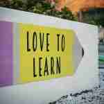 sign displaying love to learn