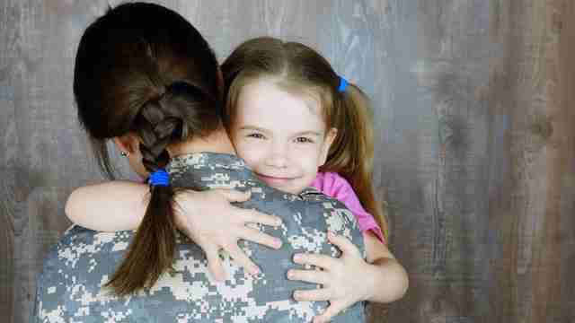 child with empathy hugging mom