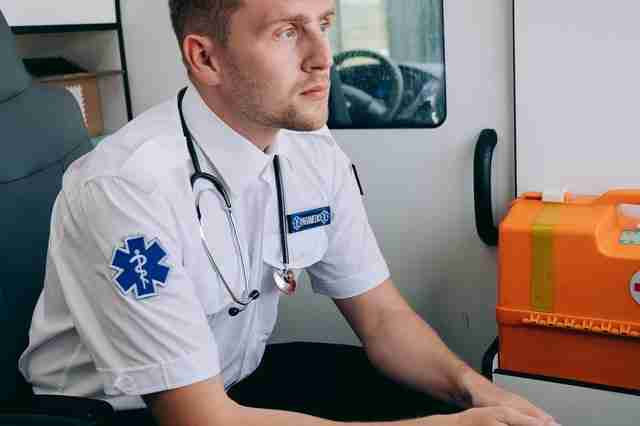 paramedic gazing into distance under stress